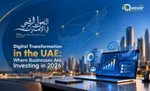 iQuasar EMEA blog banner featuring the headline "Digital Transformation in the UAE: Where Businesses Are Investing in 2026" with Arabic text, a map of the UAE, and a laptop displaying data dashboards against the Dubai skyline.